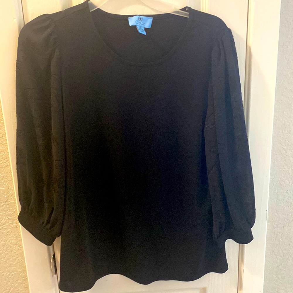 CeCe black top with flower print on sleeves